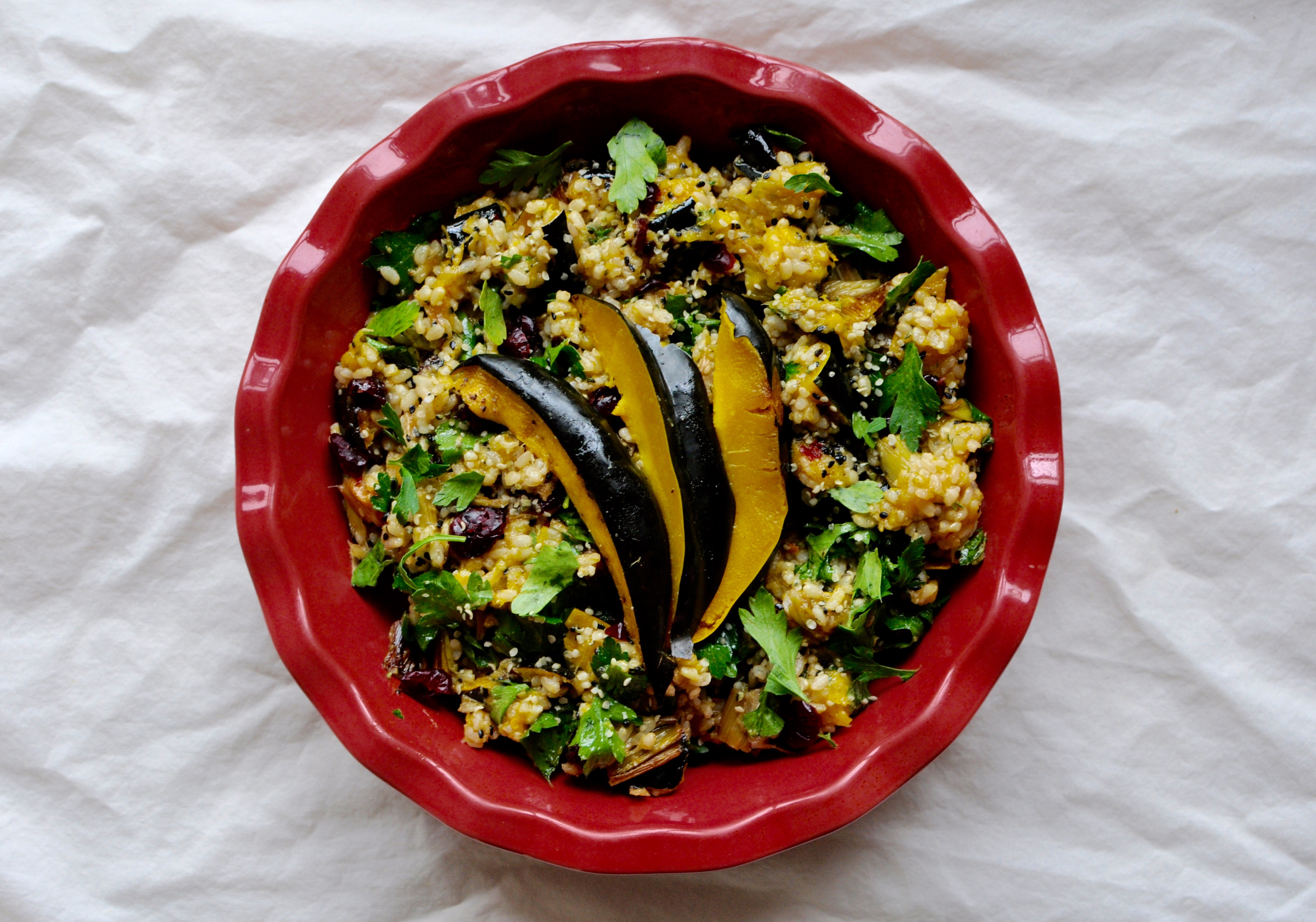 Pink platter with acorn squash and brown rice salad