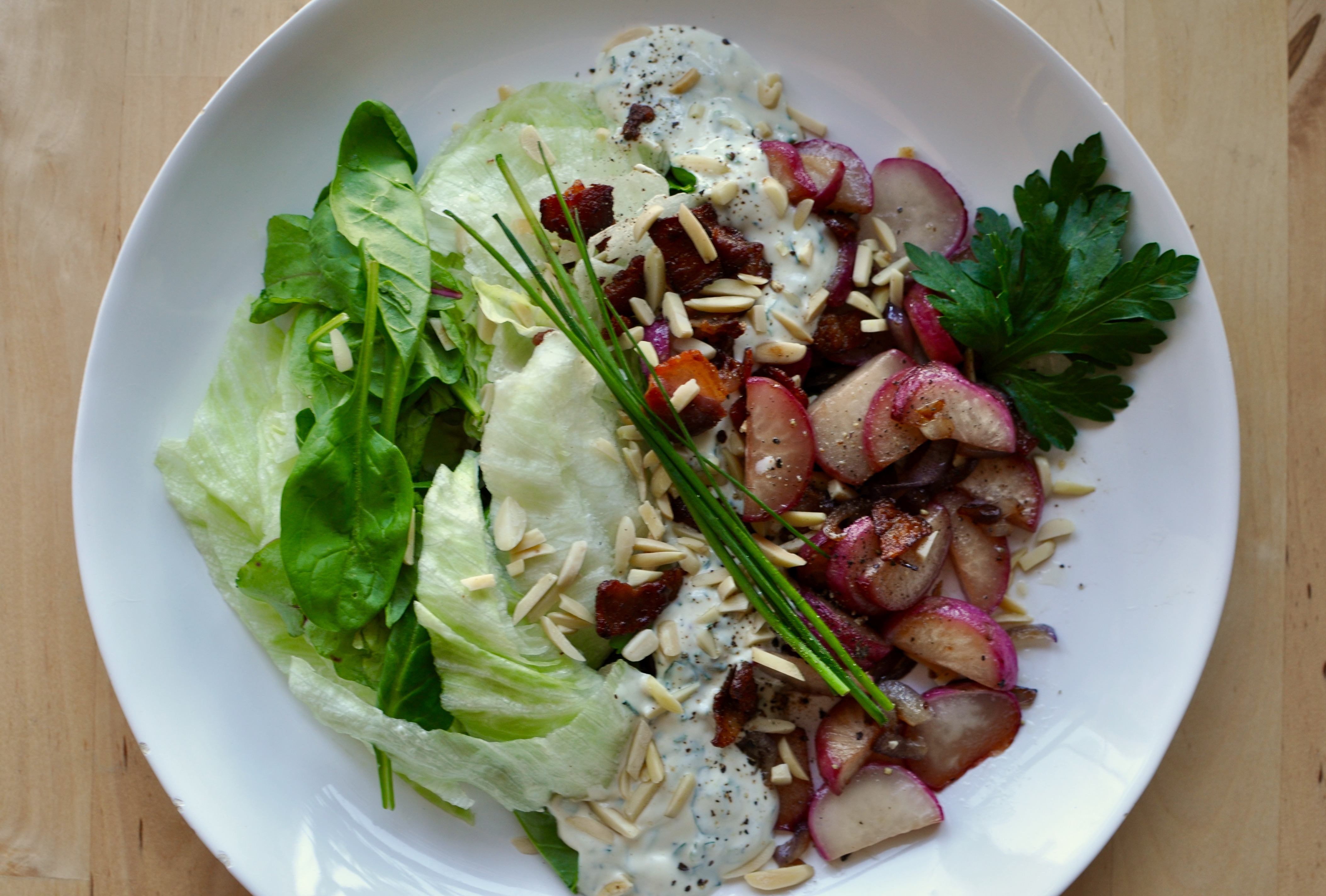 SautÃ©ed radish salad with iceberg lettuce and toasted almonds