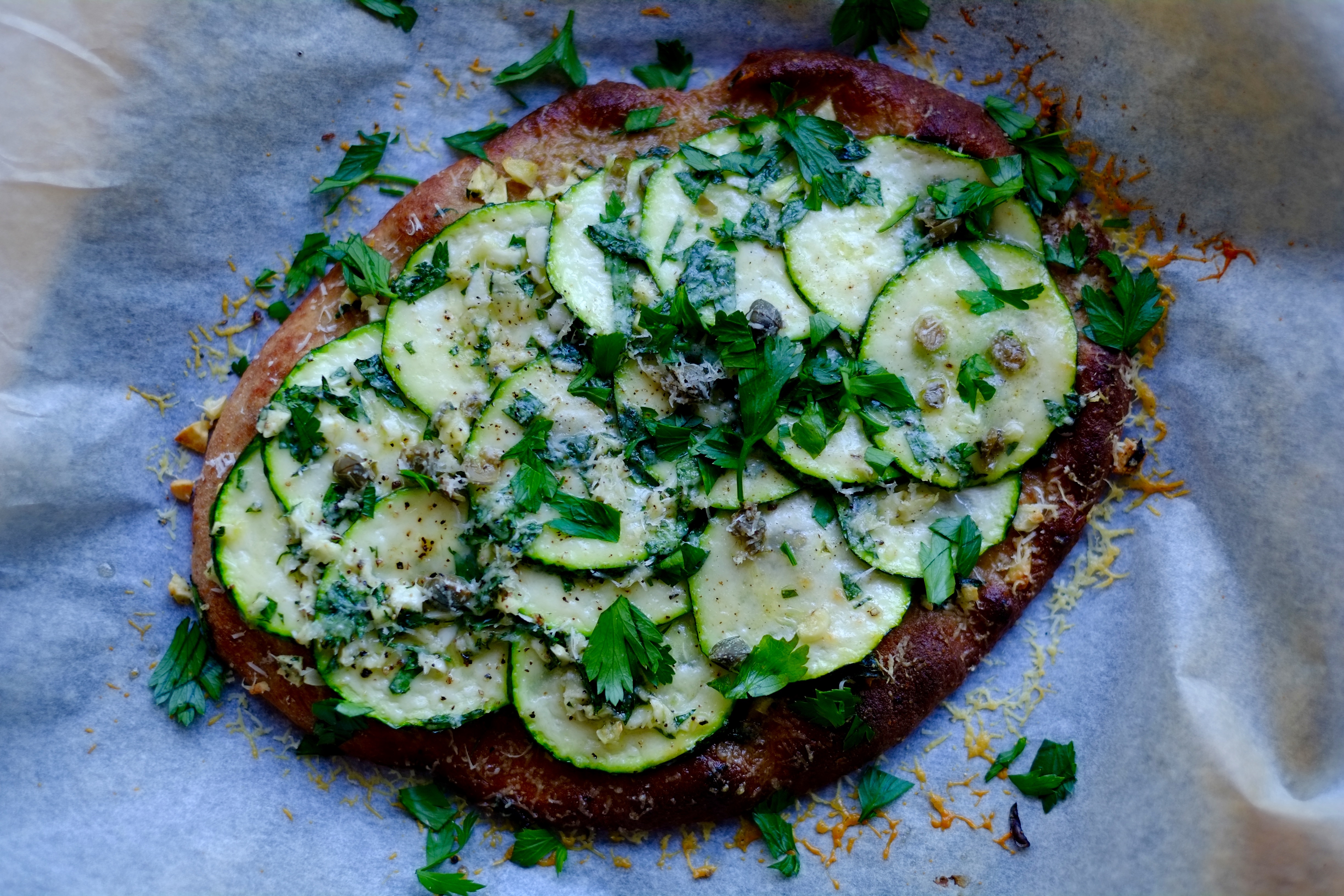 Zucchini, Caper, and Parmesan Naan Pizza